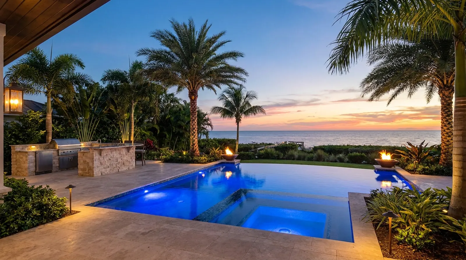 A lit pool and lanai at dusk